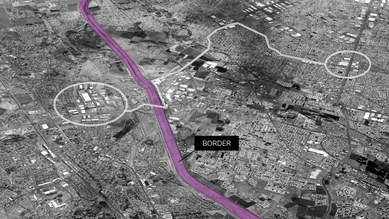 A country border separating two locations on a geospatial satellite image