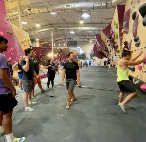 Striveworks team members have fun at a company-sponsored climbing event