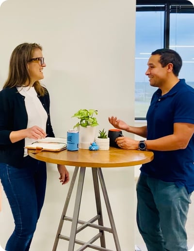 Team members in the Striveworks' office having a conversation